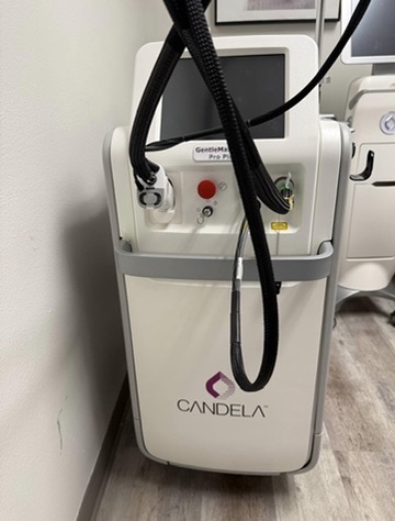 A1 Plus Laser Tech technician installing an aesthetic laser platform in a clinical treatment room